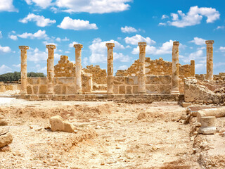 Republic of Cyprus. Paphos city. Excavations of ancient settlement. Museum complex with columns. Territory of archaeological park. Medieval city in Cyprus. Paphos under blue sky. Museums in Cyprus - obrazy, fototapety, plakaty