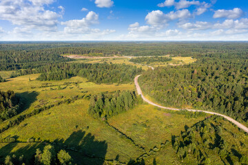 Karelia nature. Forests of Russia. Road in taiga. Karelia in sunny weather. Landscape from bird's eye view. Panorama of Russian nature. Road to lake Ladoga. Karelia landscape. Russian federation