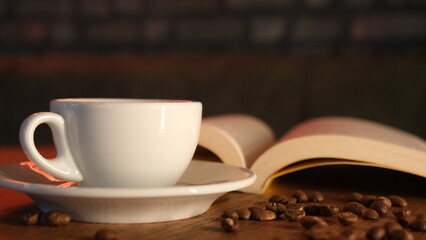 coffee grains, hot coffee and book concept