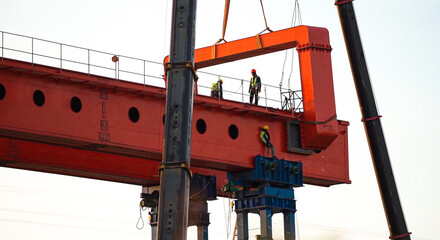Engineer and worker are working build sky hiway on crane construction.