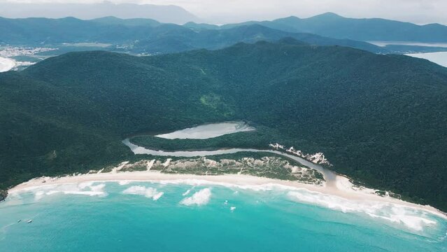 Aerial view of the sandy beach in Brazil. Lagoinha do leste beach and lagoon on the south of Brazil