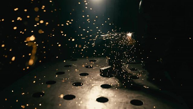 Slow motion: laser cutting, working with a metal workpiece with sparks in a factory. Metalworking, machining, industry, equipment, technology, production concept