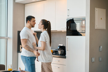 Young spouses emotionally sort things out in the kitchen