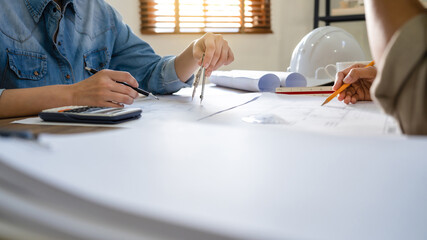 Man architect working  On the desk.construction project ideas architects engineer Concept