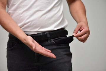 Poor man in jeans with bankruptcy concept, bankruptcy, no money, recession