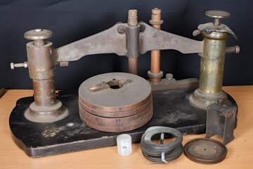 old weight, surrounded by newer, more modern weights, created with generative ai