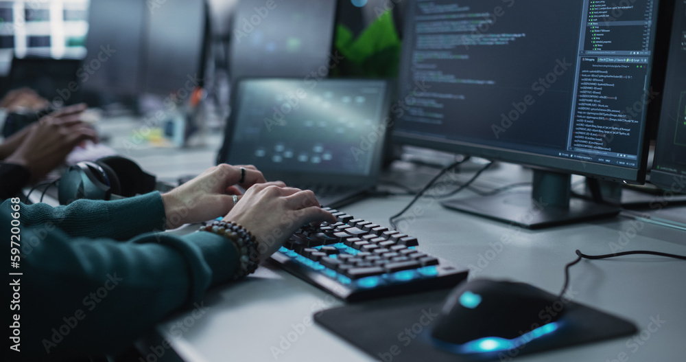 Leinwandbilder Close Up of a Software Developer Working on a Desktop Computer, Programming Code Running on Display. Specialist Typing on Keyboard, Coding and Implementing a Technical Feature, Working in an Agency