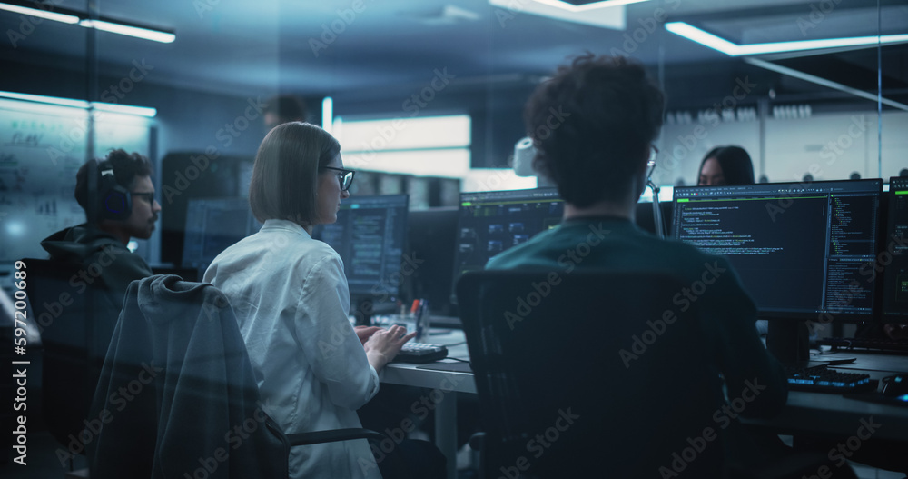 Aufkleber young female software developer working on computer together with two friendly male colleagues. fema