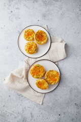 Savory muffins with egg, feta cheese, cheddar and spinach on light background