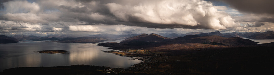 Naklejka na ściany i meble Panoramic View of Dramatic Skies from Beinn na Caillich on the Isle of Skye, Looking towards the Mainland