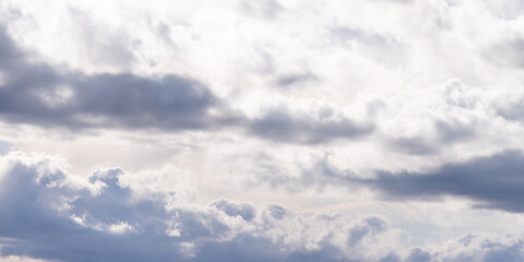 Obraz premium Gray cumulus clouds in the sky. Dramatic skies, landscape. The sky is like a background. White clouds and sky