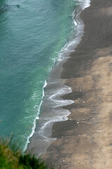 Fototapeta na wymiar waves on the pebble beach, wiew for above