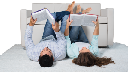 Young relaxed couple lying on the floor with book
