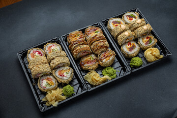delicious japanese food from chef on black background. Delivery
