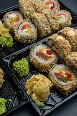 delicious japanese food from chef on black background. Delivery
