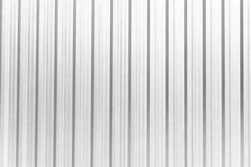Corrugated metal sheet background. Grunge old grainy metal texture. Silver color industrial pattern. Garage construction gray striped wall. Wavy gray metal background. Metal door siding.