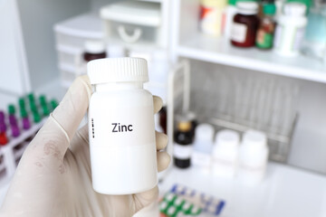 Zinc pill in white bottle, pill stock