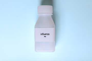 influenza pill in white bottle, pill stock