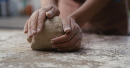 Woman hands kneading dough in the kitchen - Powered by Adobe