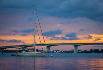 Sunset sky behind the John Ringling Causeway Bridge over Sarasota Bay in Sarasota Florida USA