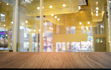 Empty dark wooden table in front of abstract blurred bokeh background of restaurant . can be used for display or montage your products.Mock up for space.