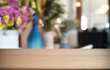 Empty dark wooden table in front of abstract blurred bokeh background of restaurant . can be used for display or montage your products.Mock up for space.