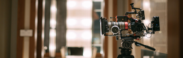 Professional cinema and video camera on the set. Shooting shift, lighting fixtures, shooting...