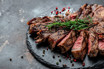 Grilled beef steak medium rare on a dark background. Restaurant menu, dieting, cookbook recipe top view