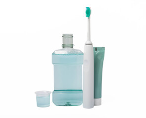 Electric toothbrush, toothpaste, mouthwash, dental floss and tongue cleaner isolated on white...