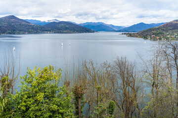 View from the hill on Lake Maggiore, sailboats and mountains