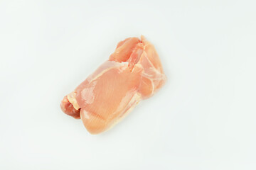 Raw fresh skinless chicken leg and thigh meat on a white background.Copy space.Food for retail.Ogranic food,healthy eating.Food concept.Top view.
