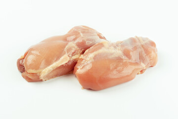 Skinless chicken meat.Raw fresh skinless chicken leg and thigh meat on a white background.Copy...