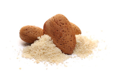 Almonds ground pile and whole with shell isolated on white  