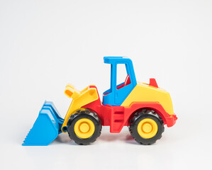 Obraz na płótnie Canvas Plastic toy models of construction vehicles. Bulldozer.