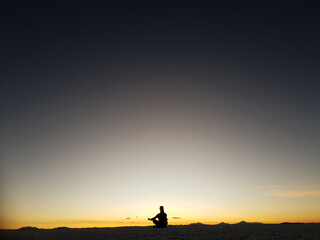 silhouette of a person on a sunset
