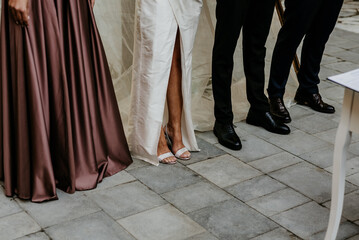 wedding shoes bridal white sandals hands dress wedd ring bride and groom inspo hairstyles ceremony details bow bouquet 