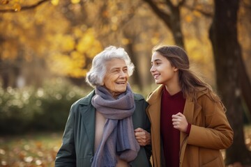 Fototapeta premium Senior woman walking with granddaughter in park. generative AI