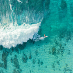 Surfer on the wave in Hawaii aerial
