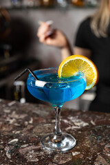 Alcohol cocktail on the bar. bartender prepares an alcoholic cocktail . delicious drink
