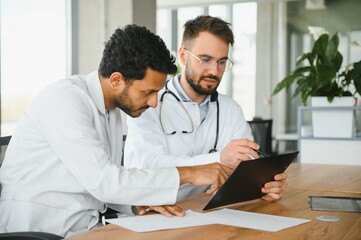 Two young male doctors in the clinic