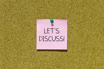 Let's discuss text on pink post-it paper pinned on bulletin cork board. This message can be used in...