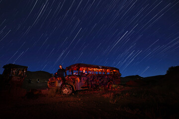 Spooky Night Sky Imagery With Abandoned Vehicles as Foreground - 597247276