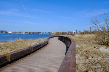Obraz premium Parnu river wooden promenade along the river. New modern infrastructure for recreation.