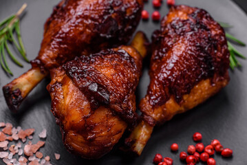 Delicious grilled chicken legs with spices and herbs in teriyaki sauce