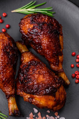 Delicious grilled chicken legs with spices and herbs in teriyaki sauce