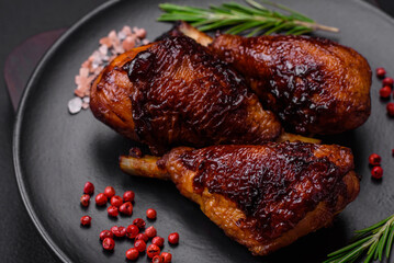 Delicious grilled chicken legs with spices and herbs in teriyaki sauce