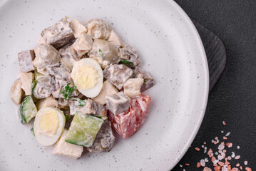 Delicious salad with boiled beef tongue, quail eggs, tomatoes and cucumber