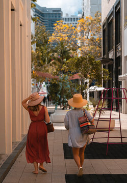 two woman walking in the street couple summer vacation miami design district  
