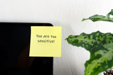 Gaslighting text on adhesive note - You are too sensitive