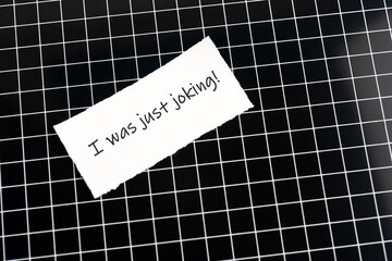 Gaslighting text on adhesive note - I was just joking